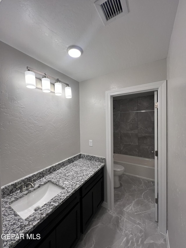 3720 Hill Top Place, El Paso, TX 79938 - bathroom featuring marble look tiles, vanity, and shower / bathtub combination