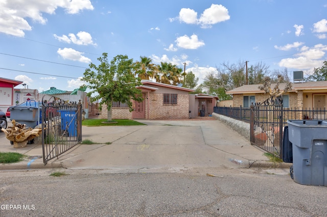 123 Marquita Ln, El Paso, TX 79915 - view of front of house featuring brick siding, a gate, and a fenced front yard