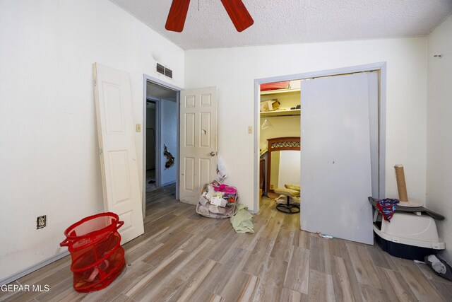 123 Marquita Ln, El Paso, TX 79915 - bedroom featuring wood finished floors, a textured ceiling, a closet, a ceiling fan, and vaulted ceiling