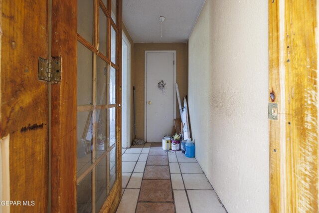 123 Marquita Ln, El Paso, TX 79915 - hall featuring light tile patterned floors