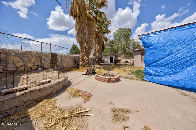 123 Marquita Ln, El Paso, TX 79915 - view of yard featuring a fire pit and a patio