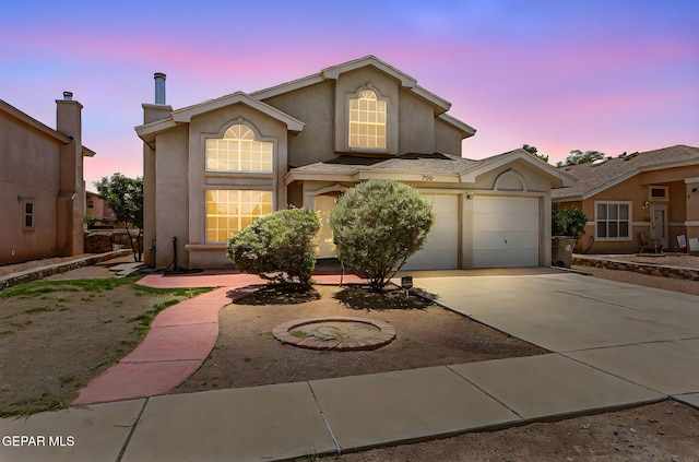 700 Milton Henry Ave, El Paso, TX 79932 - view of front of property with stucco siding, driveway, and an attached garage