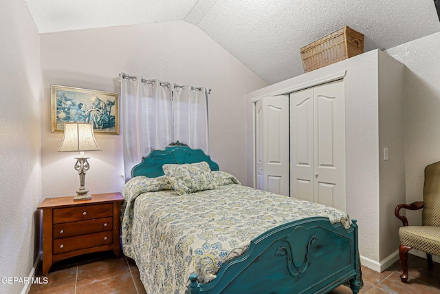 700 Milton Henry Ave, El Paso, TX 79932 - bedroom featuring tile patterned floors, vaulted ceiling, and a closet