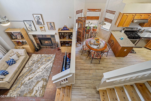 700 Milton Henry Ave, El Paso, TX 79932 - living area featuring a fireplace and light wood-style floors