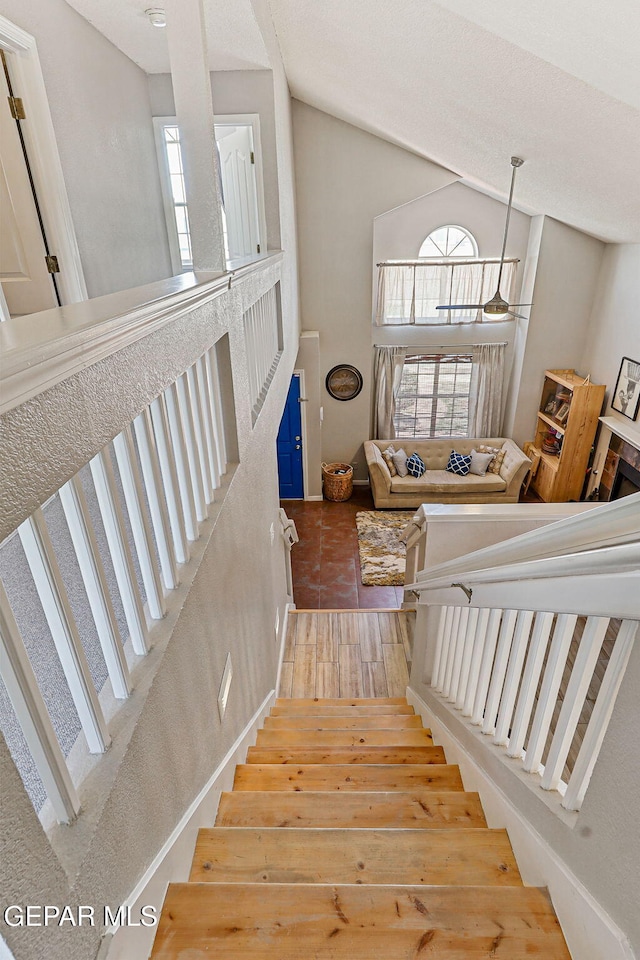 700 Milton Henry Ave, El Paso, TX 79932 - staircase featuring plenty of natural light, vaulted ceiling, and wood finished floors