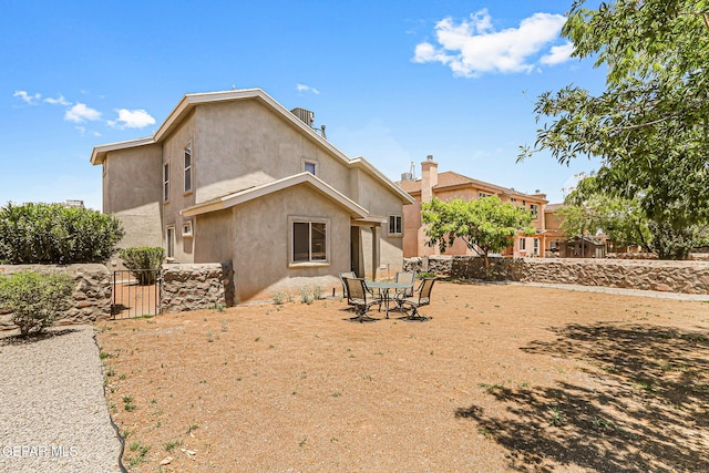 700 Milton Henry Ave, El Paso, TX 79932 - back of house featuring a gate and stucco siding