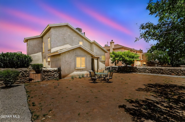 700 Milton Henry Ave, El Paso, TX 79932 - rear view of house with a gate and stucco siding