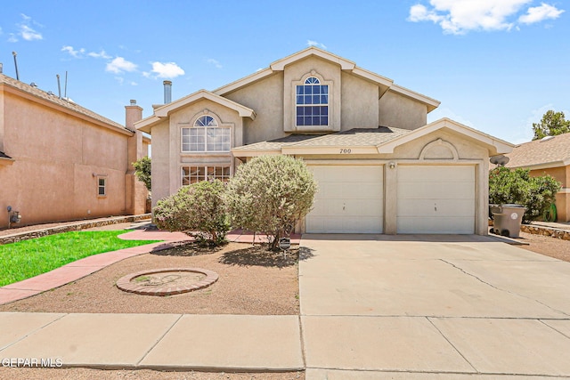 700 Milton Henry Ave, El Paso, TX 79932 - view of front of home featuring stucco siding, concrete driveway, and a shingled roof