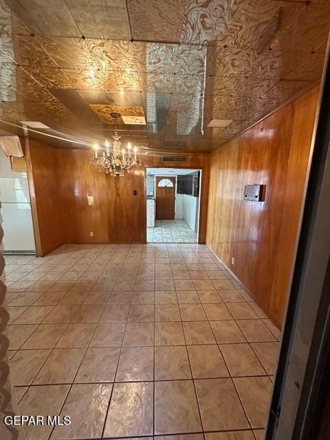 7190 Fatima Ave, El Paso, TX 79915 - hall with wood walls, a chandelier, and an ornate ceiling