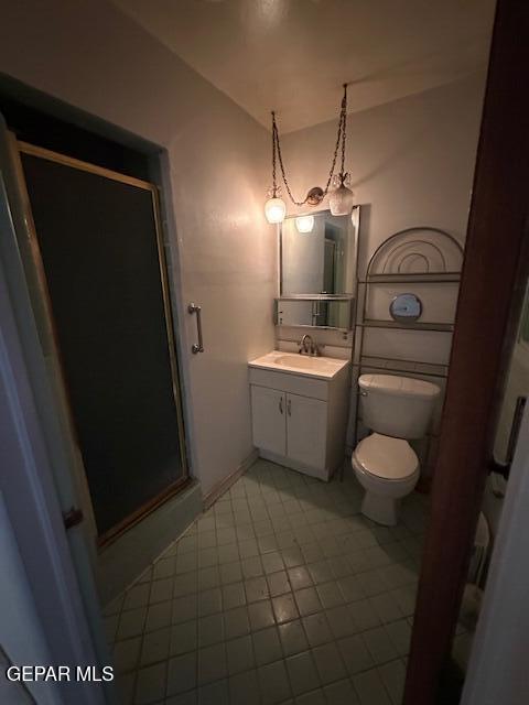 7190 Fatima Ave, El Paso, TX 79915 - full bath featuring vanity, a shower stall, and tile patterned floors