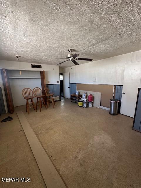 7190 Fatima Ave, El Paso, TX 79915 - living room with a ceiling fan and a textured ceiling