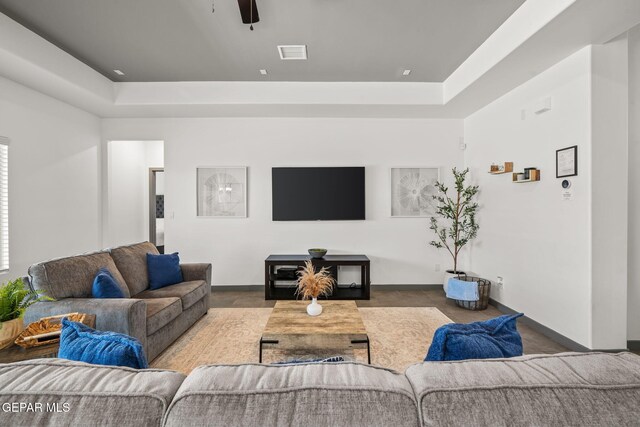 13699 Kathys Ct, El Paso, TX 79928 - living room featuring a tray ceiling and ceiling fan