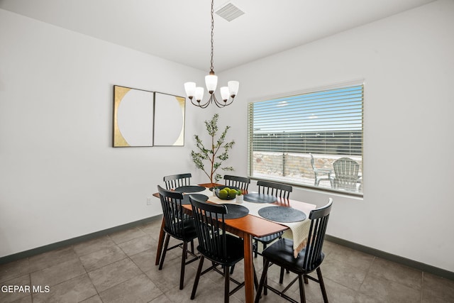 13699 Kathys Ct, El Paso, TX 79928 - dining room featuring a chandelier and baseboards
