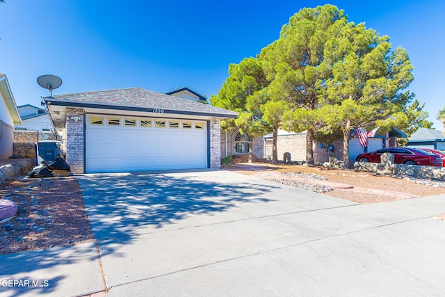 1550 Cezanne Cir, El Paso, TX 79936 - single story home featuring driveway, an attached garage, and brick siding
