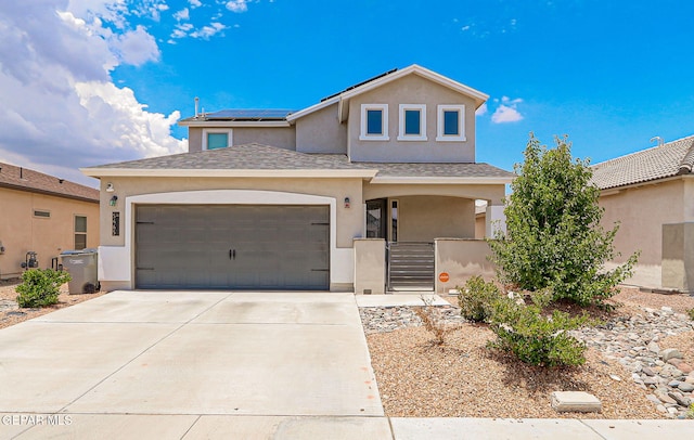 5465 Limestone Dr, El Paso, TX 79934 - traditional-style house with stucco siding, solar panels, driveway, covered porch, and an attached garage