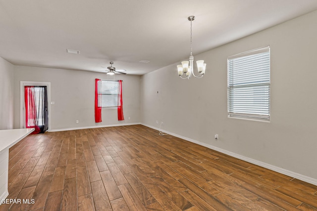 5465 Limestone Dr, El Paso, TX 79934 - empty room featuring dark wood-style flooring, a chandelier, and ceiling fan