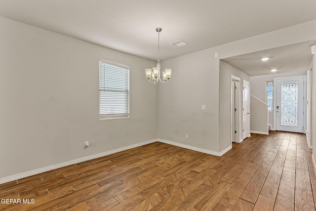 5465 Limestone Dr, El Paso, TX 79934 - empty room with wood finished floors and a chandelier