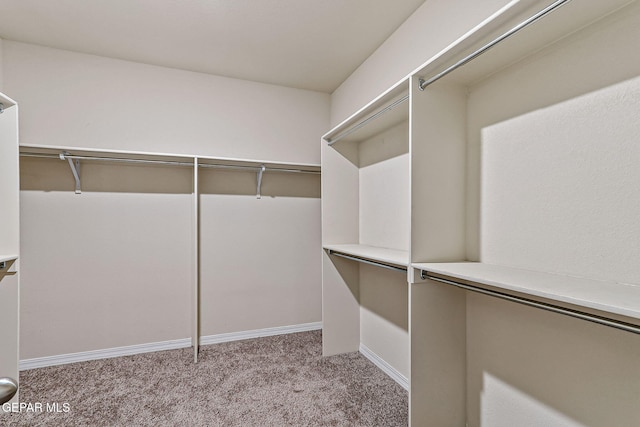 5465 Limestone Dr, El Paso, TX 79934 - walk in closet featuring light colored carpet