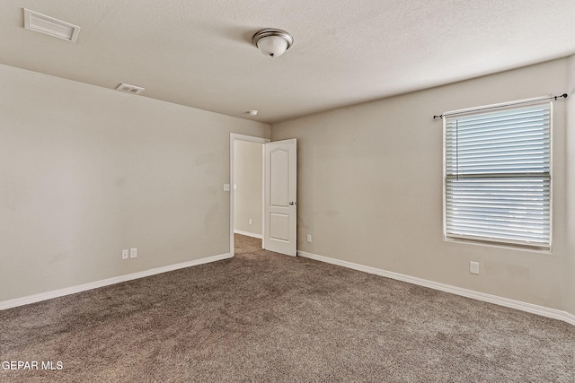 5465 Limestone Dr, El Paso, TX 79934 - carpeted empty room with baseboards and a textured ceiling