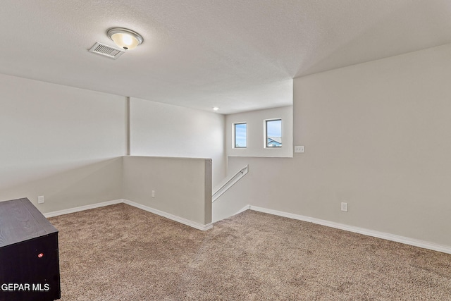 5465 Limestone Dr, El Paso, TX 79934 - basement with carpet flooring and a textured ceiling