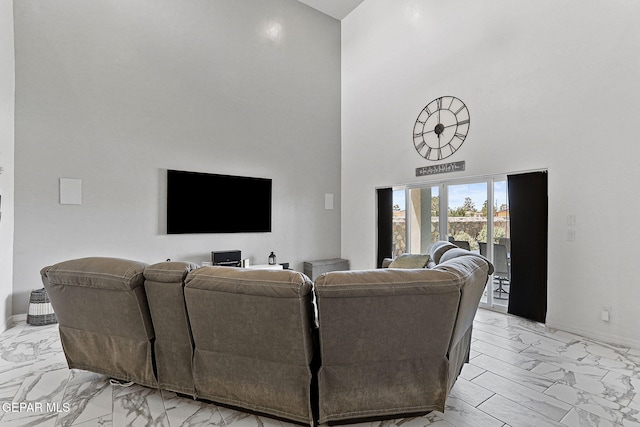 3725 Surmise St, El Paso, TX 79938 - living room featuring light marble finish floors and a towering ceiling