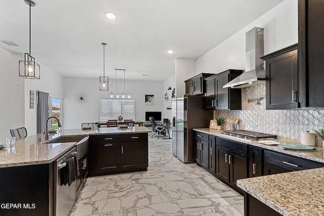 3725 Surmise St, El Paso, TX 79938 - kitchen with wall chimney exhaust hood, appliances with stainless steel finishes, light marble finish floors, a desk, and tasteful backsplash