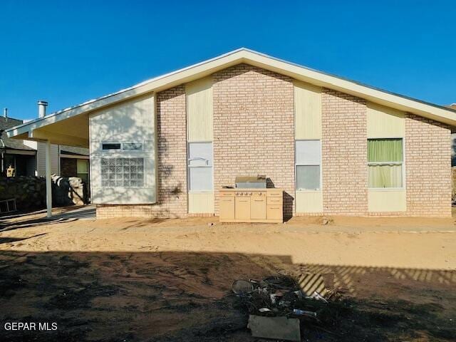 10940 Golden Pond Dr, El Paso, TX 79934 - view of side of property featuring brick siding