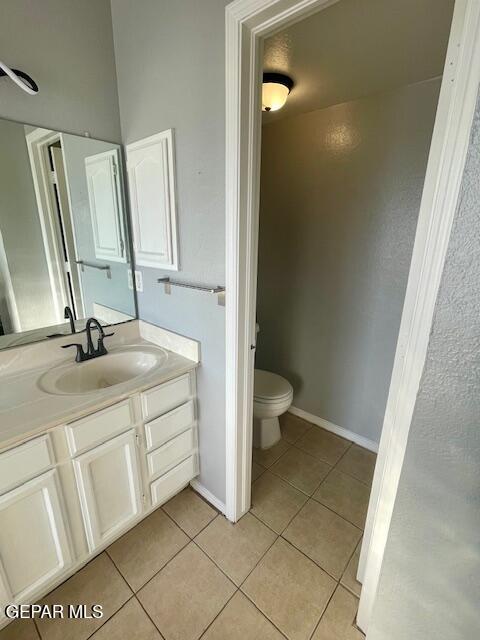 10940 Golden Pond Dr, El Paso, TX 79934 - bathroom featuring tile patterned floors and vanity