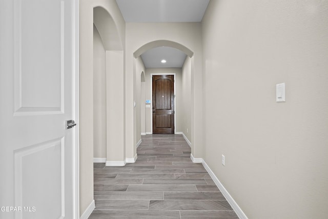 912 Malven Pl, El Paso, TX 79928 - corridor featuring arched walkways and wood finished floors