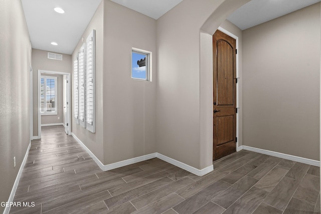 912 Malven Pl, El Paso, TX 79928 - corridor with arched walkways, wood tiled floors, and recessed lighting