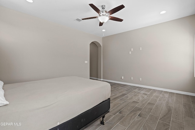 912 Malven Pl, El Paso, TX 79928 - bedroom featuring arched walkways, recessed lighting, ceiling fan, and wood finished floors