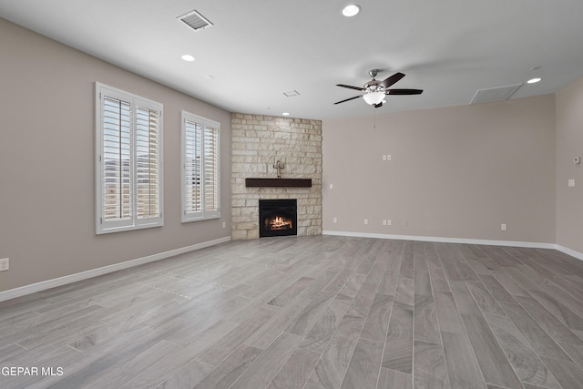 912 Malven Pl, El Paso, TX 79928 - unfurnished living room featuring a ceiling fan, light wood-type flooring, recessed lighting, and a fireplace