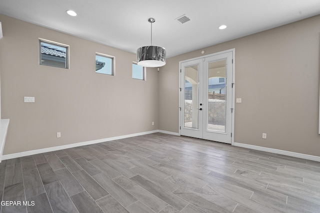 912 Malven Pl, El Paso, TX 79928 - empty room with french doors, wood finished floors, and recessed lighting