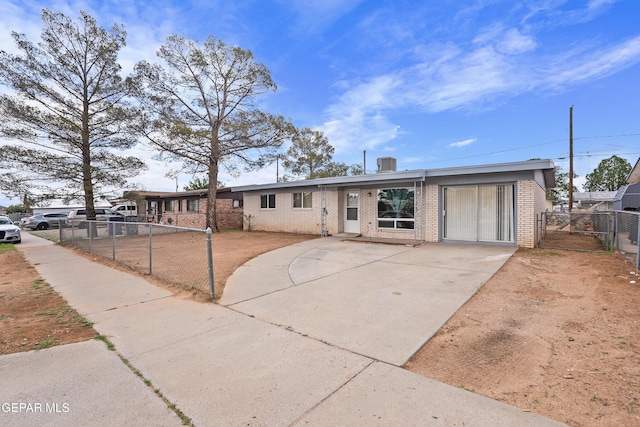 5828 Blackhawk Dr, El Paso, TX 79924 - view of front facade featuring brick siding, driveway, and a gate