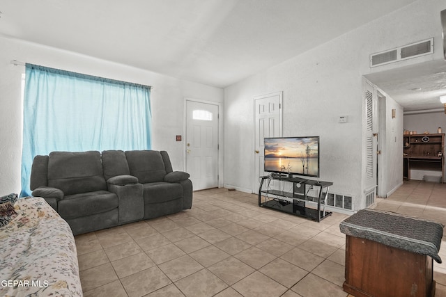 5828 Blackhawk Dr, El Paso, TX 79924 - living area featuring light tile patterned floors and lofted ceiling