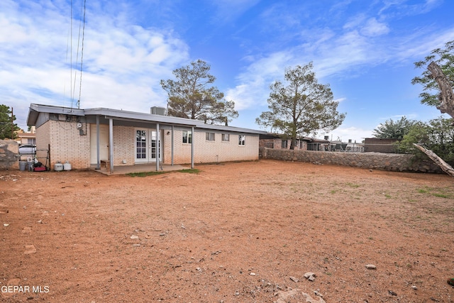 5828 Blackhawk Dr, El Paso, TX 79924 - back of house with brick siding and a patio area