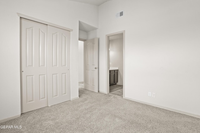 4609 Al Hernandez St, El Paso, TX 79938 - unfurnished bedroom featuring light colored carpet, a closet, high vaulted ceiling, and ensuite bathroom