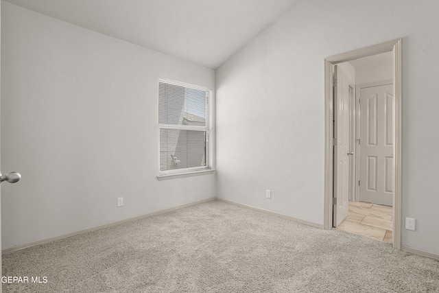 4609 Al Hernandez St, El Paso, TX 79938 - carpeted empty room with lofted ceiling and baseboards