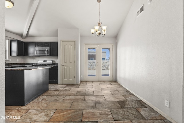 4609 Al Hernandez St, El Paso, TX 79938 - kitchen featuring stainless steel microwave, range, dark cabinets, dark countertops, and french doors
