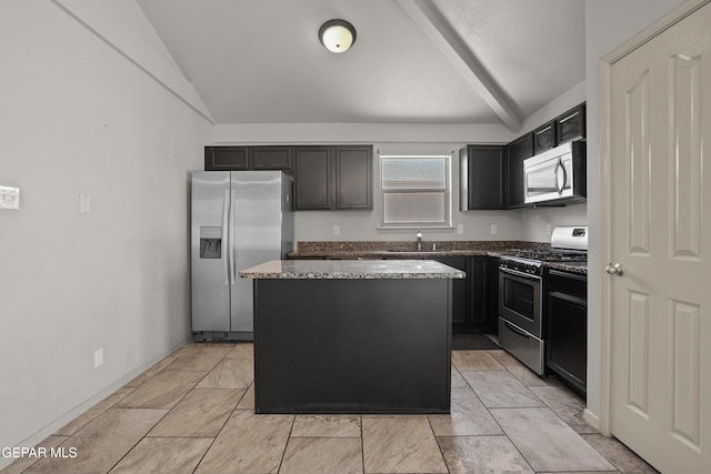4609 Al Hernandez St, El Paso, TX 79938 - kitchen featuring stainless steel appliances, a kitchen island, dark stone countertops, and dark cabinetry