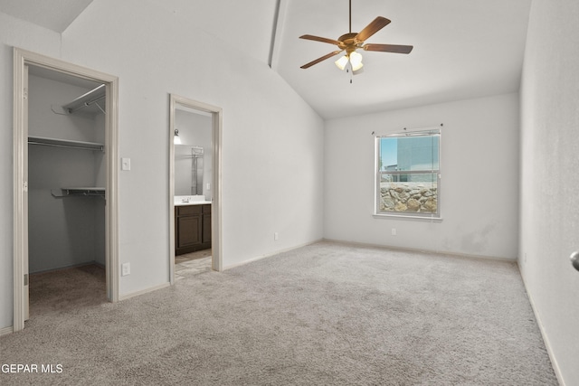 4609 Al Hernandez St, El Paso, TX 79938 - unfurnished bedroom featuring lofted ceiling, a spacious closet, carpet floors, ensuite bath, and a ceiling fan