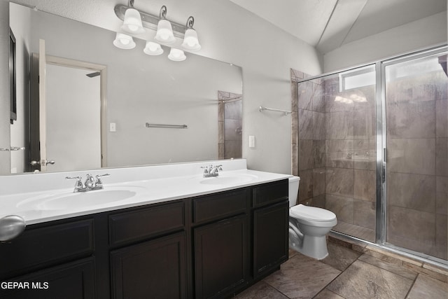 4609 Al Hernandez St, El Paso, TX 79938 - full bathroom featuring double vanity, a shower stall, and lofted ceiling