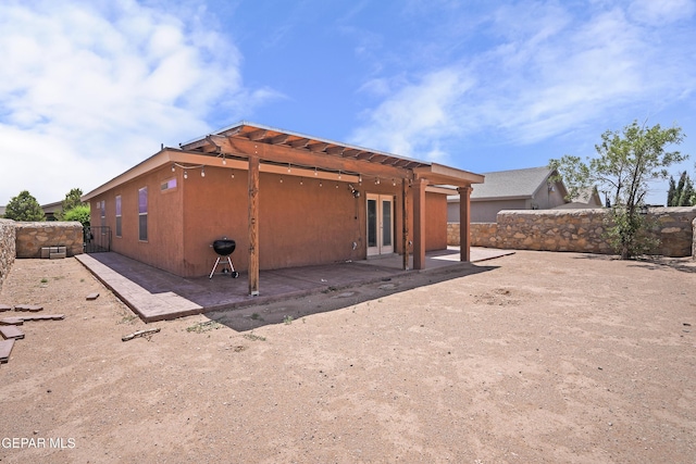 4609 Al Hernandez St, El Paso, TX 79938 - back of property featuring french doors, a fenced backyard, and a patio