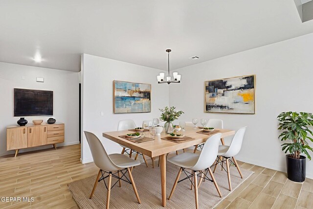 248 Farnborough St, El Paso, TX 79928 - dining room with wood tiled floors and a chandelier