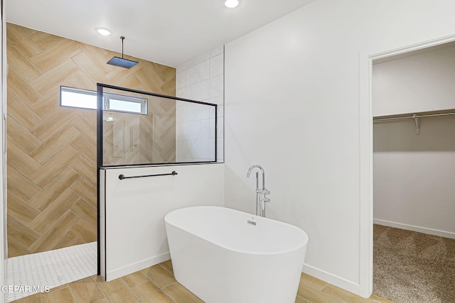 248 Farnborough St, El Paso, TX 79928 - full bath with walk in shower, a freestanding bath, a walk in closet, and recessed lighting