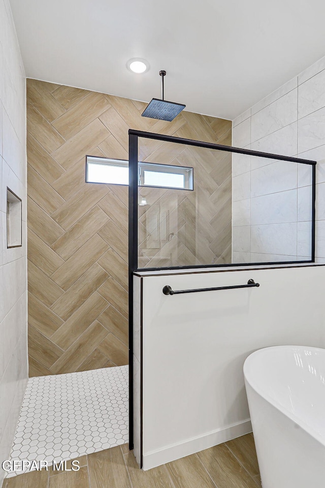 248 Farnborough St, El Paso, TX 79928 - bathroom featuring a walk in shower and a freestanding bath