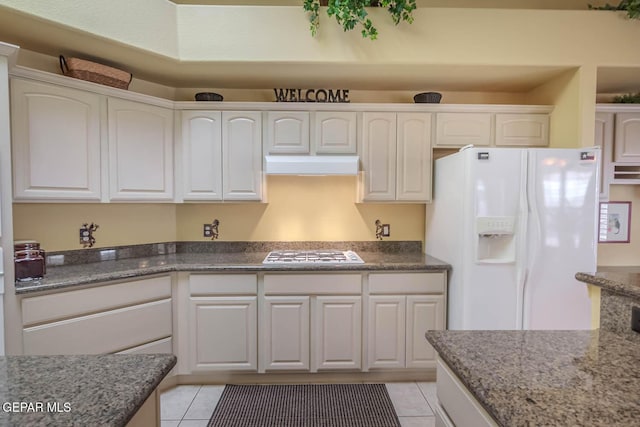 6316 Franklin Red Dr, El Paso, TX 79912 - kitchen featuring white fridge with ice dispenser, gas stovetop, white cabinetry, and custom exhaust hood
