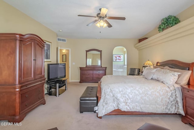 6316 Franklin Red Dr, El Paso, TX 79912 - bedroom with light colored carpet, connected bathroom, and a ceiling fan