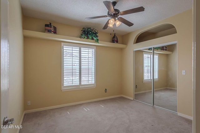 6316 Franklin Red Dr, El Paso, TX 79912 - unfurnished bedroom featuring carpet, a textured ceiling, a closet, and ceiling fan