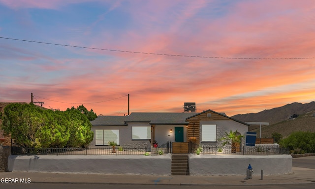721 Mesita Dr, El Paso, TX 79902 - view of front of home featuring a fenced front yard and stucco siding